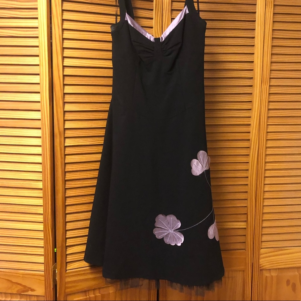Black dress with purple detail at neck and skirt